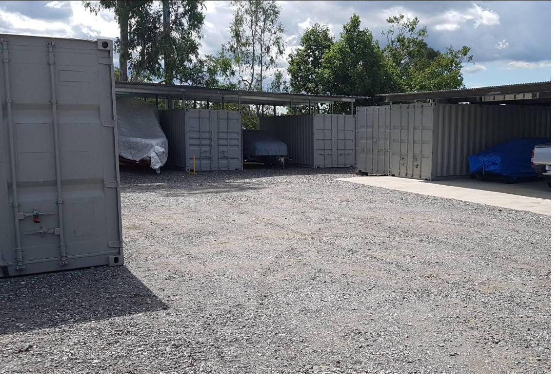 Undercover vehicle parking bays with covered cars and 20ft storage containers at Oxley Storage and Parking, Brisbane southside